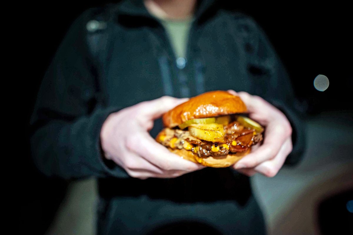 a man holds a burger