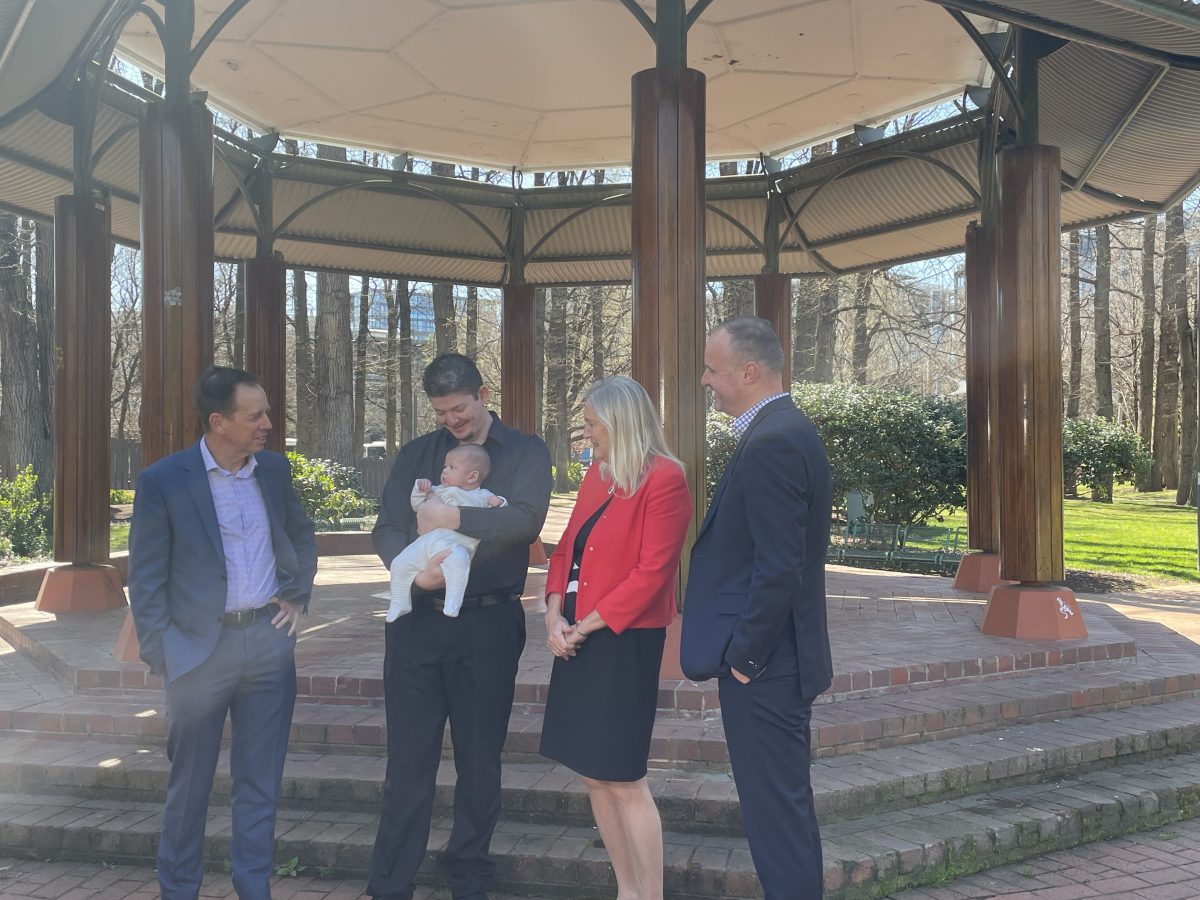 Attorney-General Shane Rattenbury, Eoghan Clwyde and Flynn, Care CEO Carmel Franklin and Chief Minister Andrew Barr at the announcement of the boost to the Rent Relief Fund