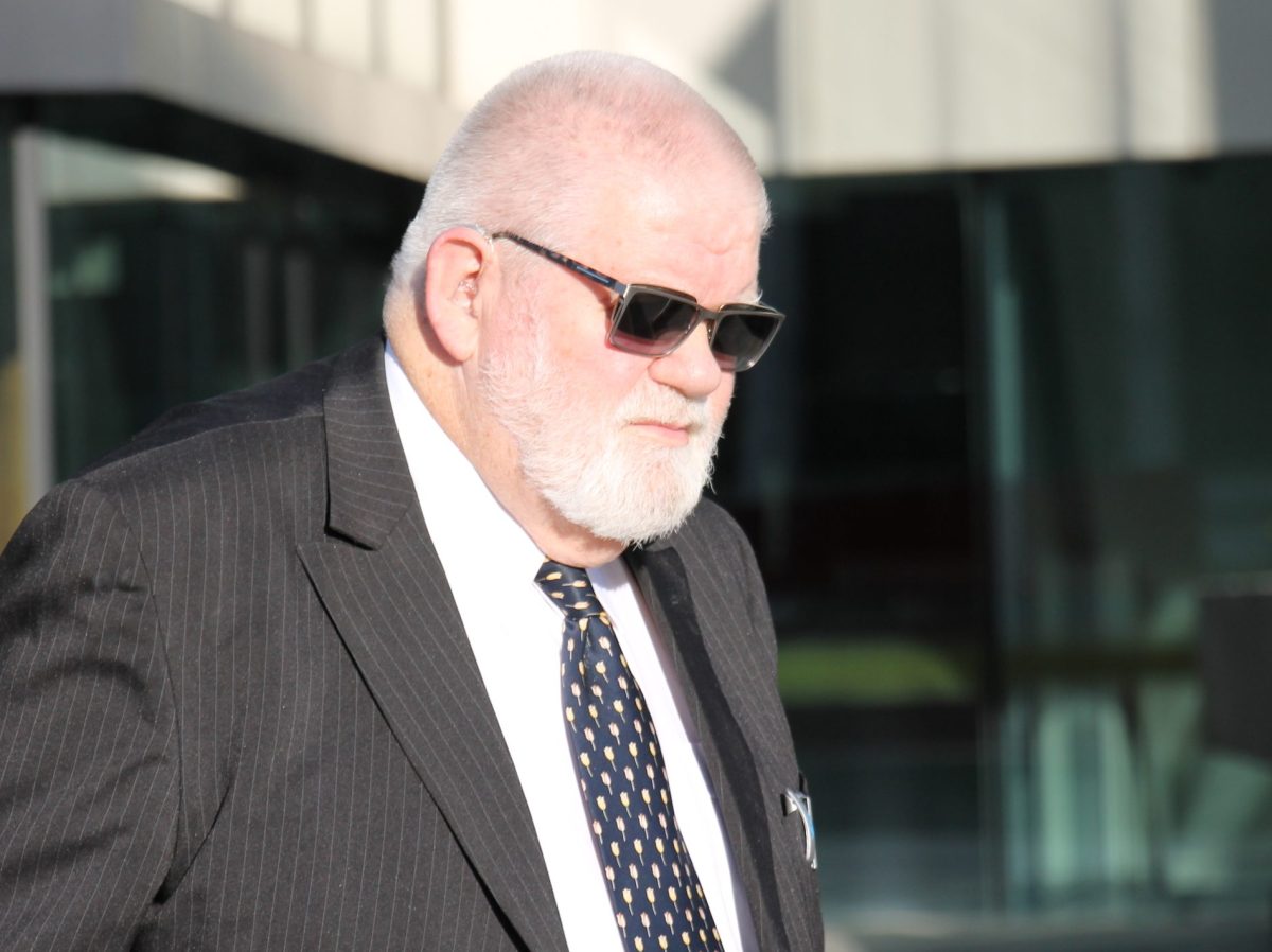 man in sunglasses leaving court