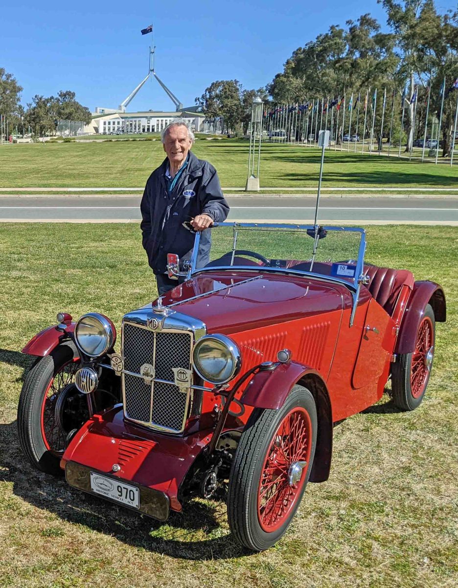 old MG near Parliament House with its owner