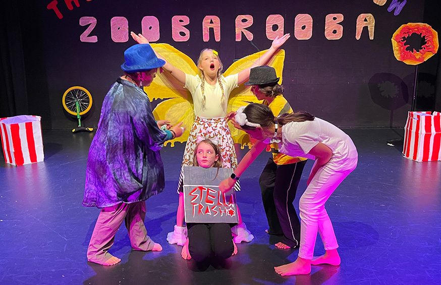 Children on the middle of a theatre production