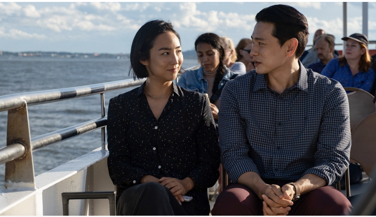 two people on a ferry look at each other