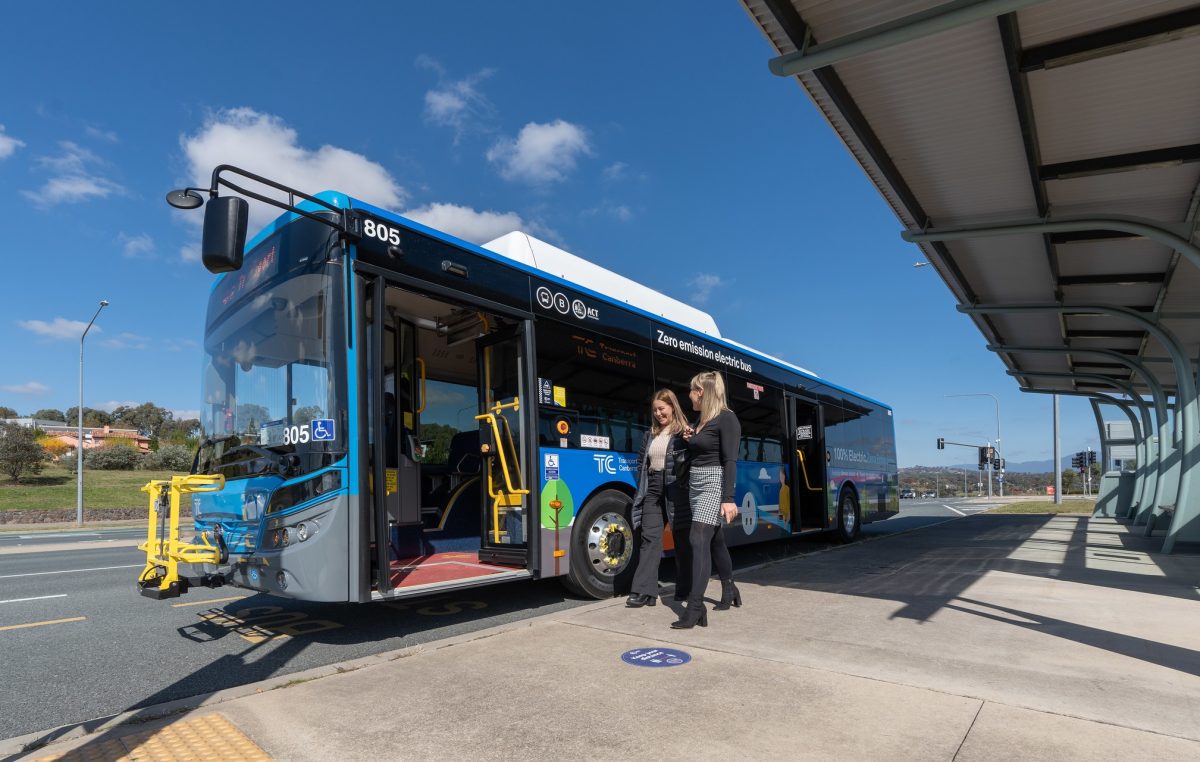 two people catching the 805 bus