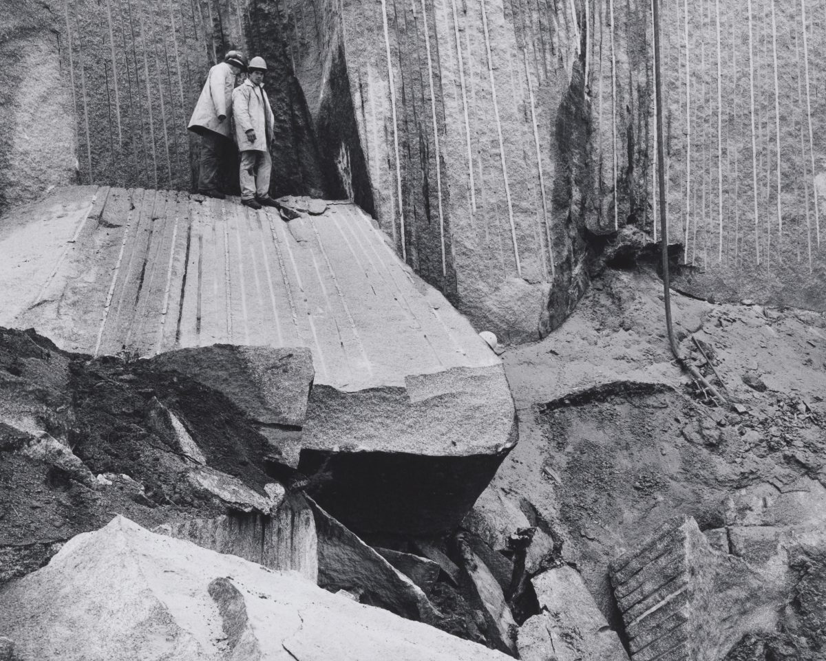 Two officials inspect granite in Eugowra.