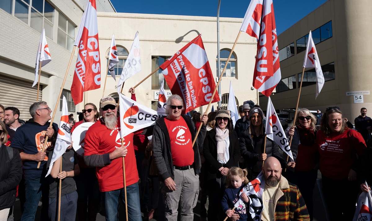 CPSU members fly their red and white union flags