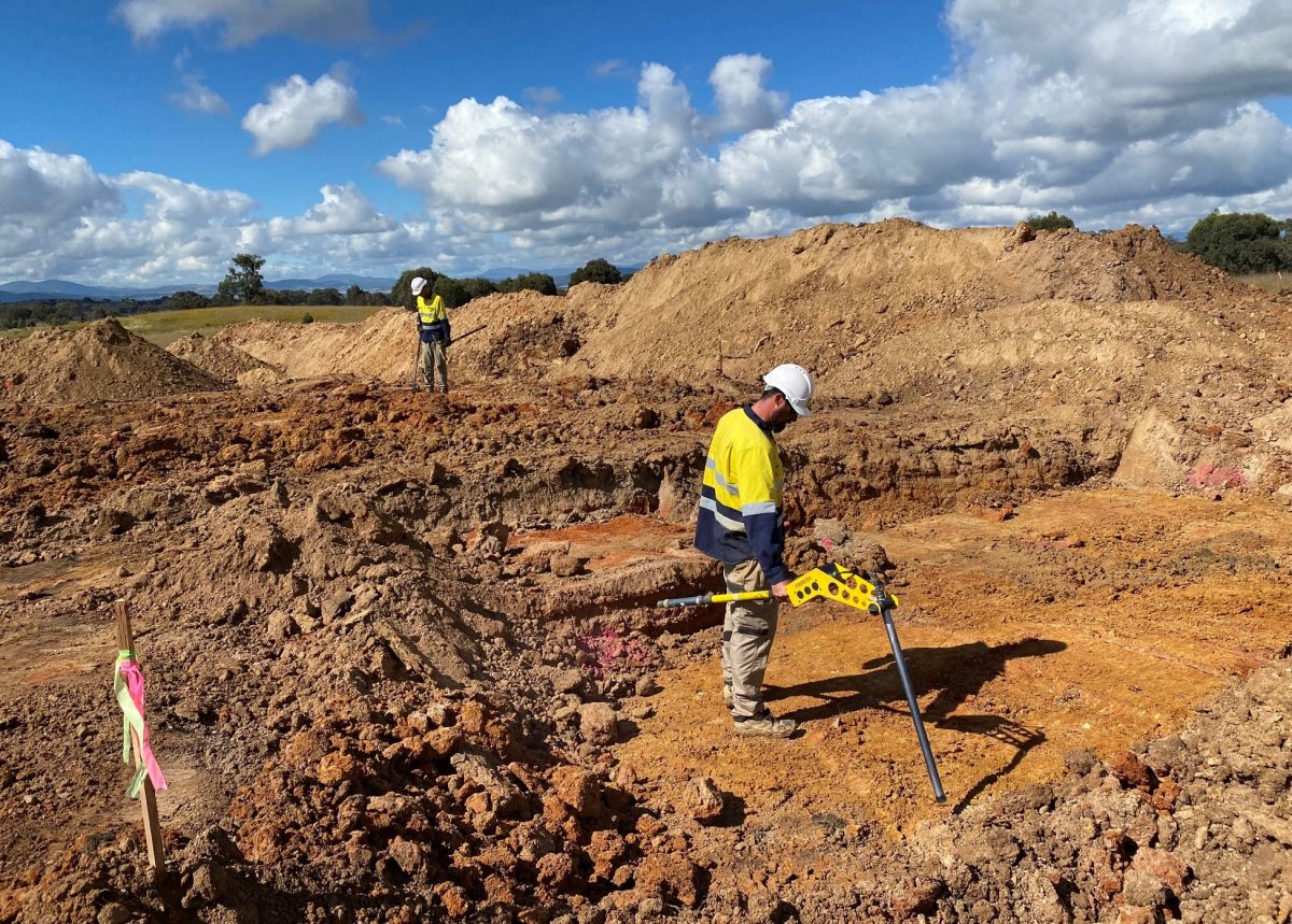 contractors working with metal detectors