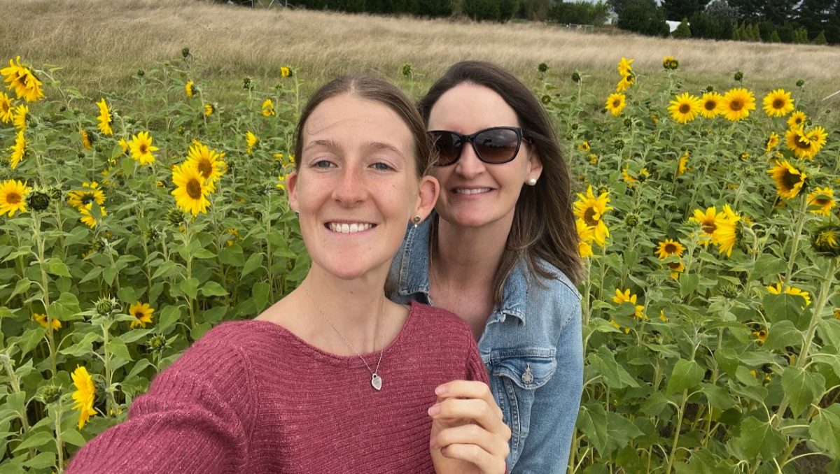 Abby and Jessica McBrien in a sunflower field