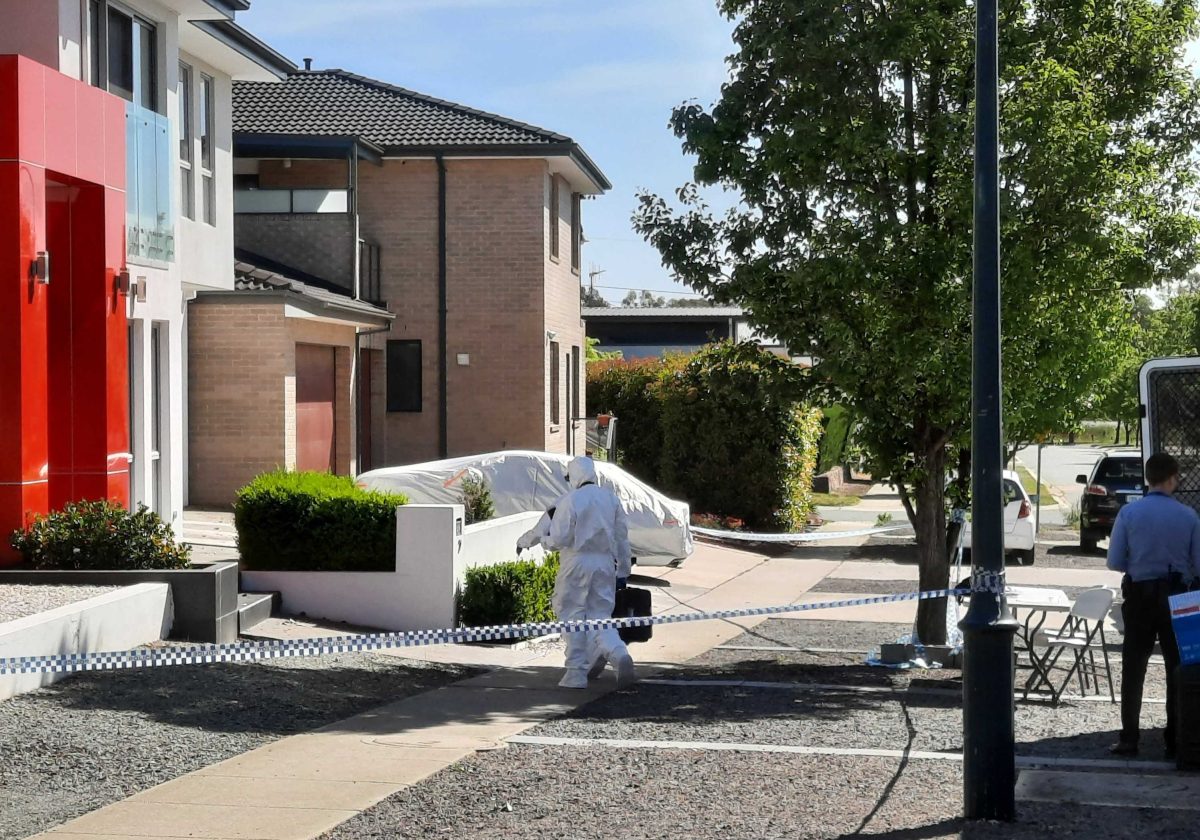 forensic police outside apartments in Bruce