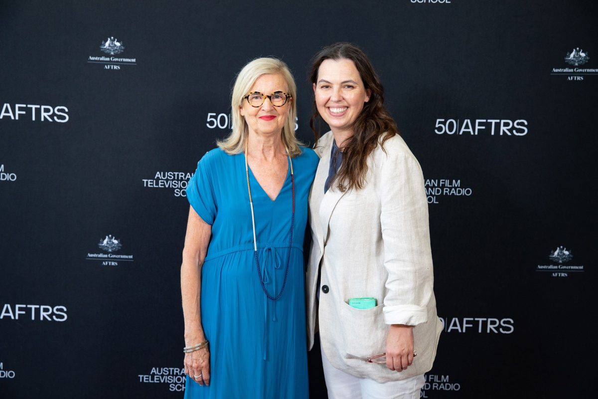 Gillian (left) and Nell (right) standing together on the red carpet at a 50th anniversary for AFTRS.