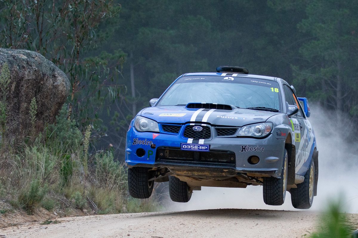 rally car in the air on course