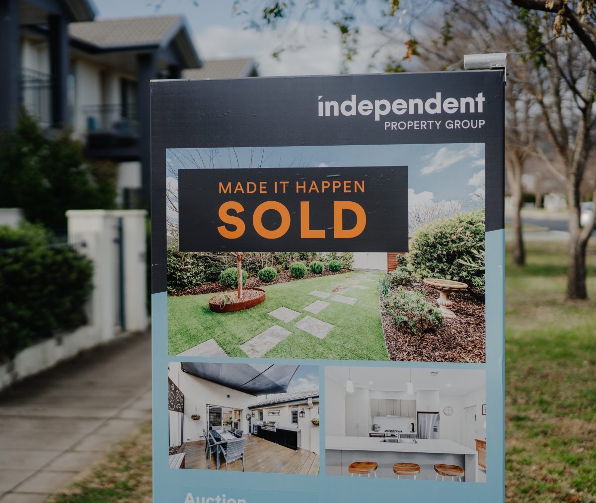 Independent Property Group sold sign outside a block of homes