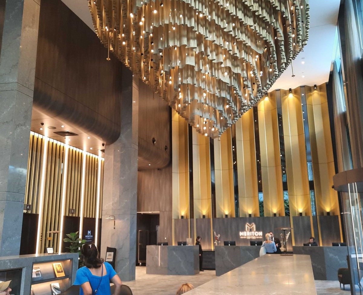 The Meriton Suites lobby with chandelier. 