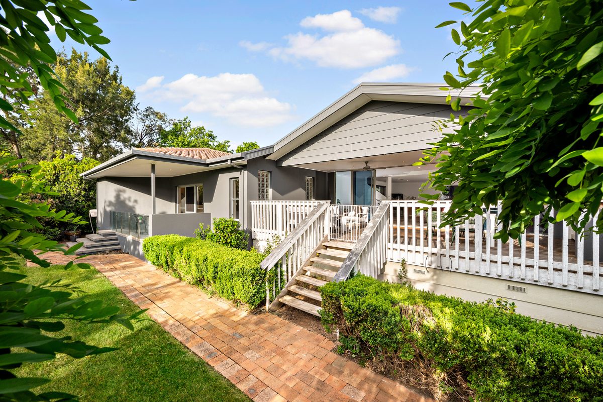 A house with front porch and lawn.