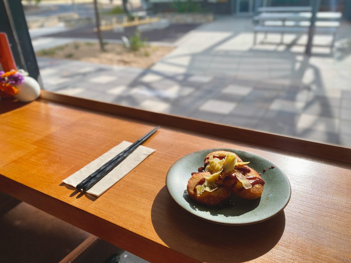 Small plate with dumplings on a bar.