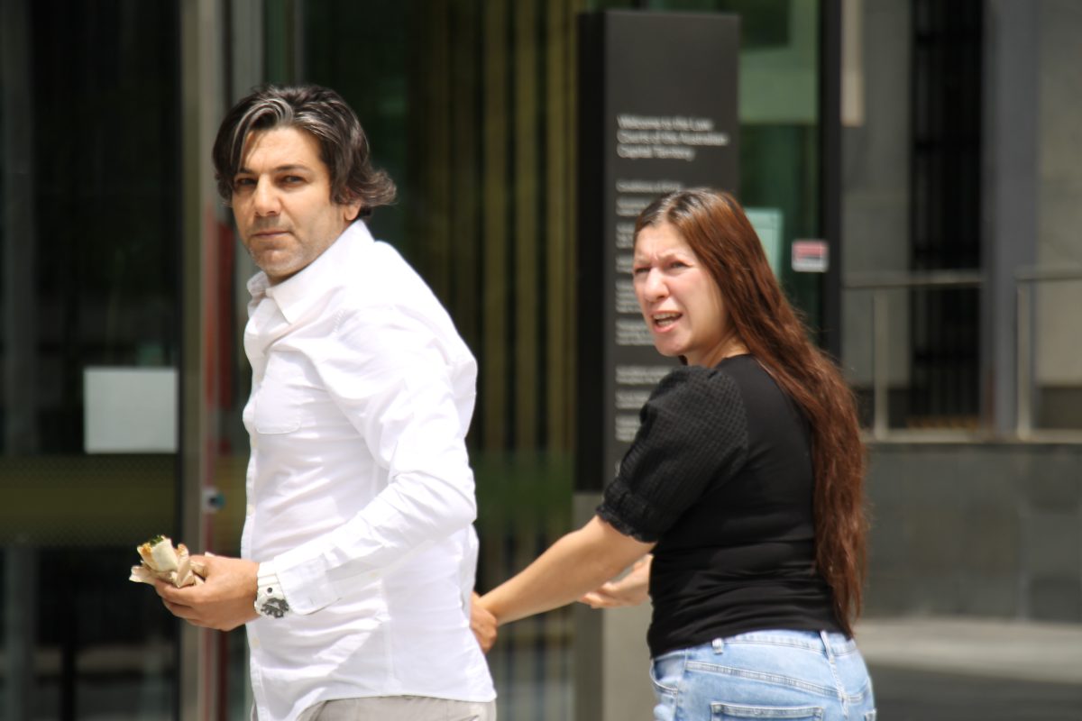 man and woman entering court