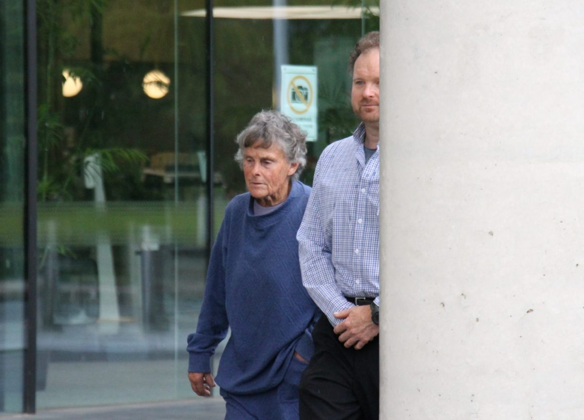 older woman leaving court