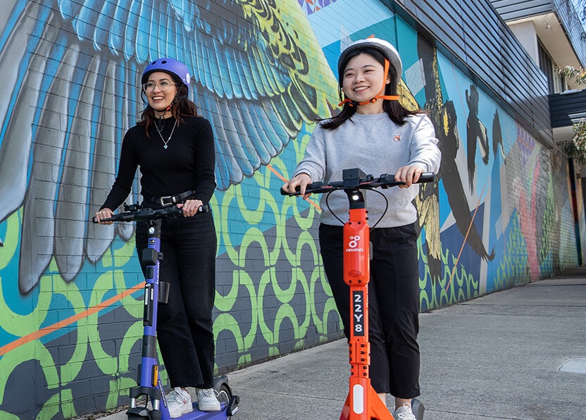 people riding e-scooters