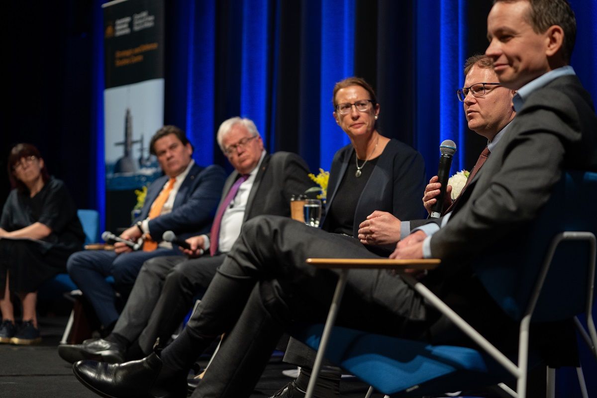 people on stage during a presentation