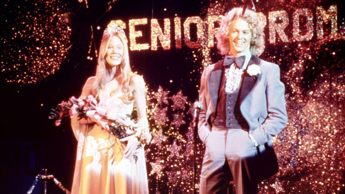 A young woman and man standing at an American prom