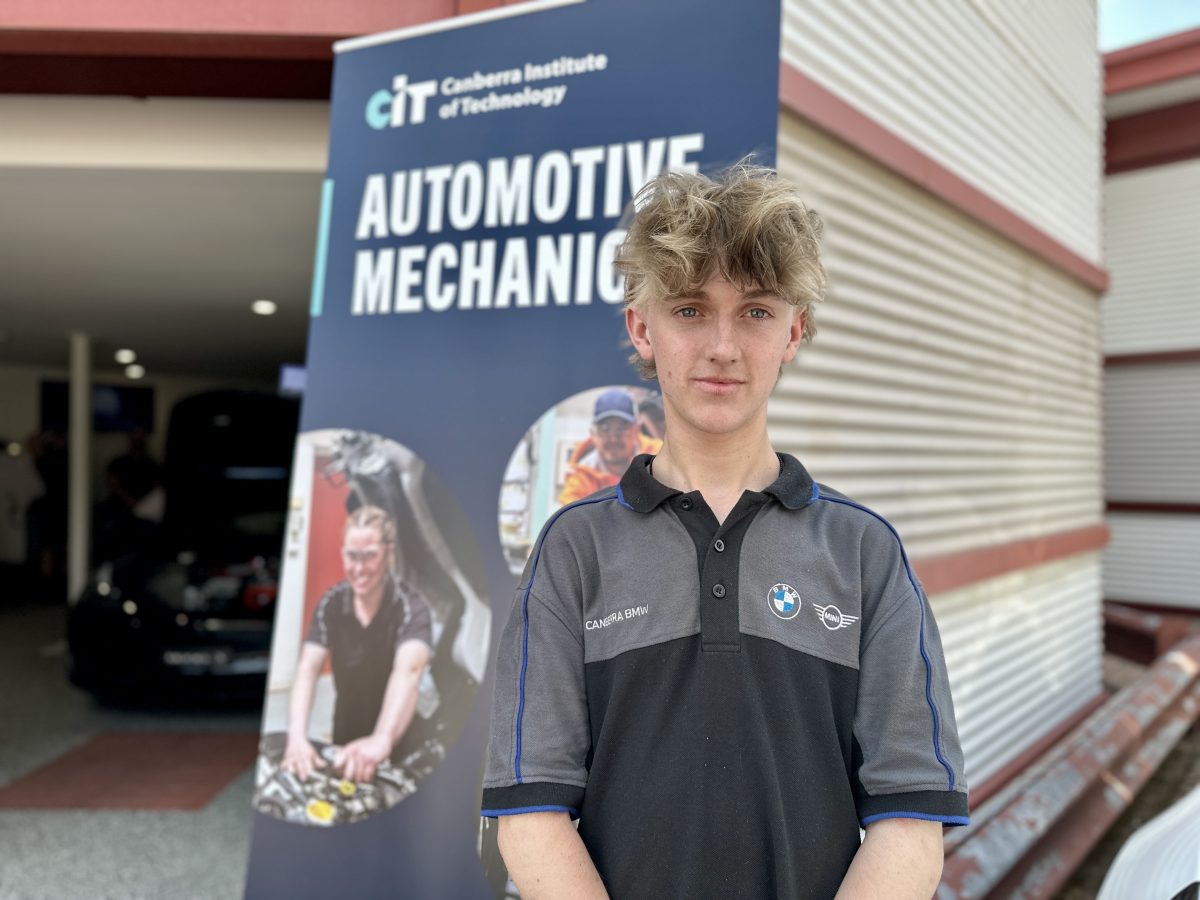 apprentice outside an EV workshop