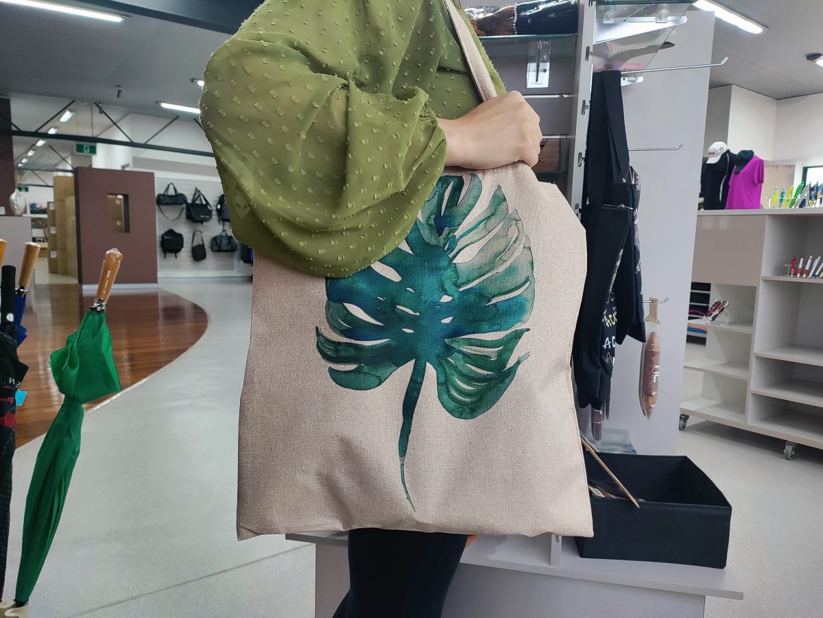 Woman holding a sustainable tote bag