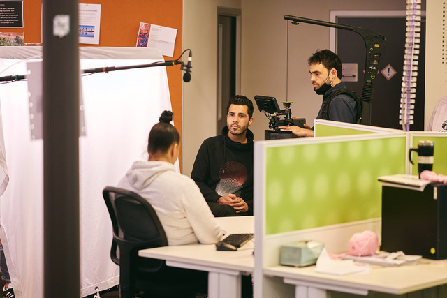 Three people shooting a documentary