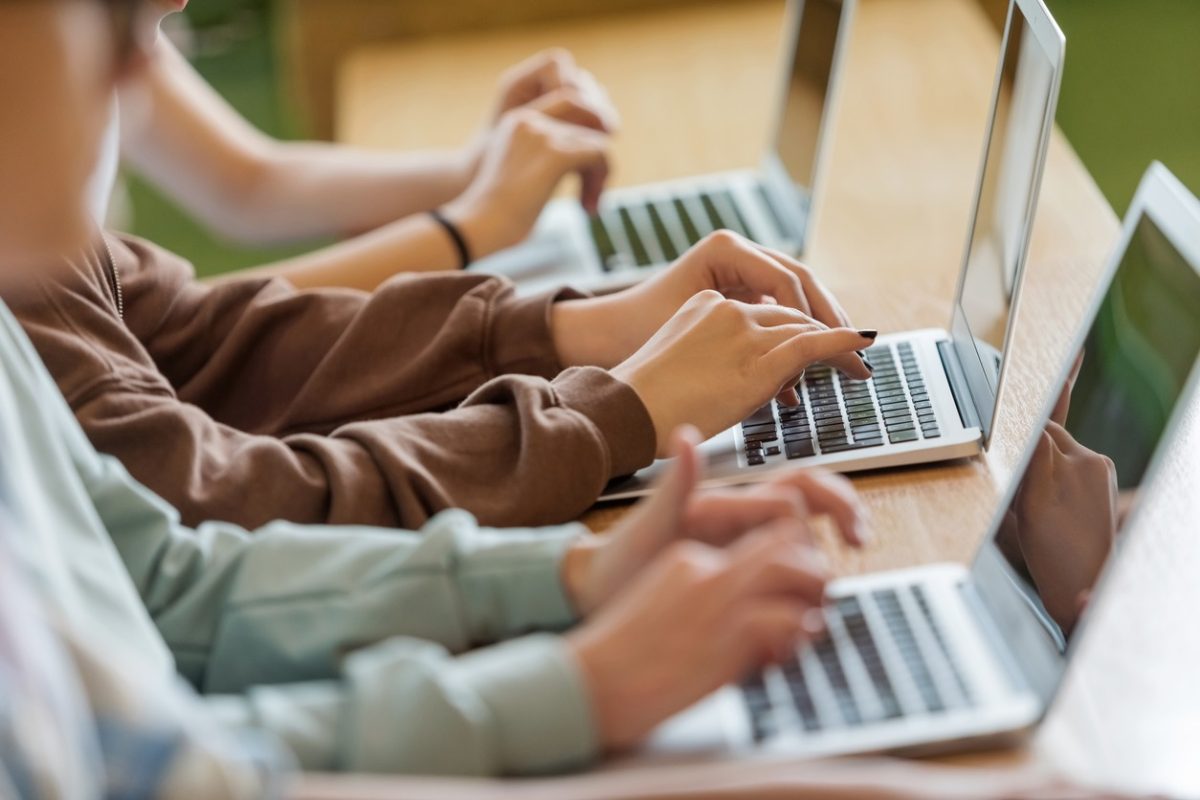 group of students using laptops