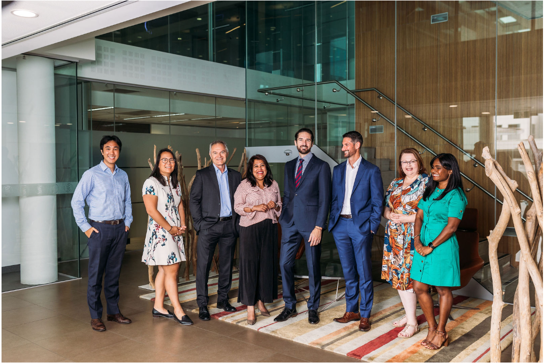 group of people standing in a building foyer