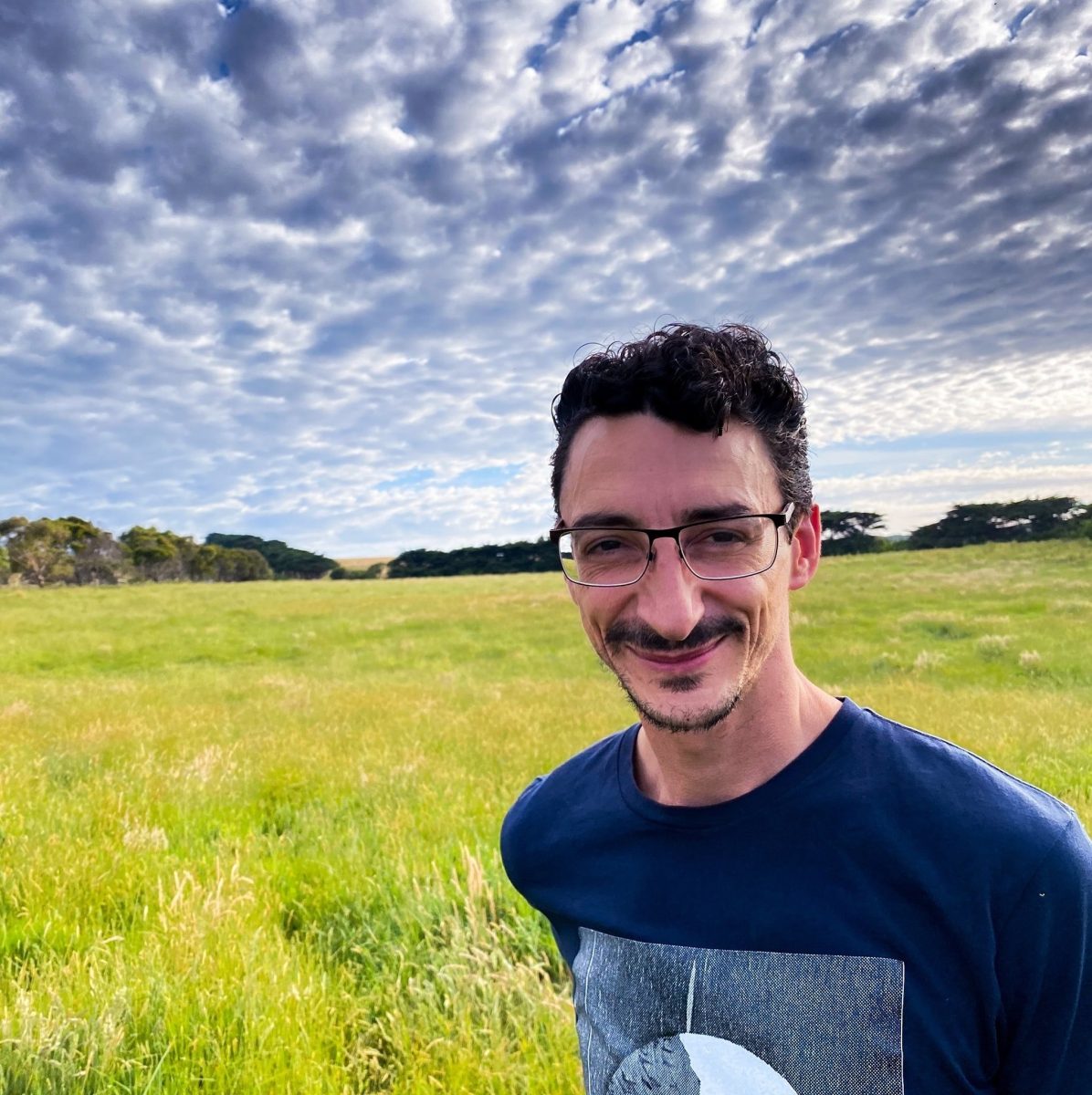 Johnny Tsatsakis in a field