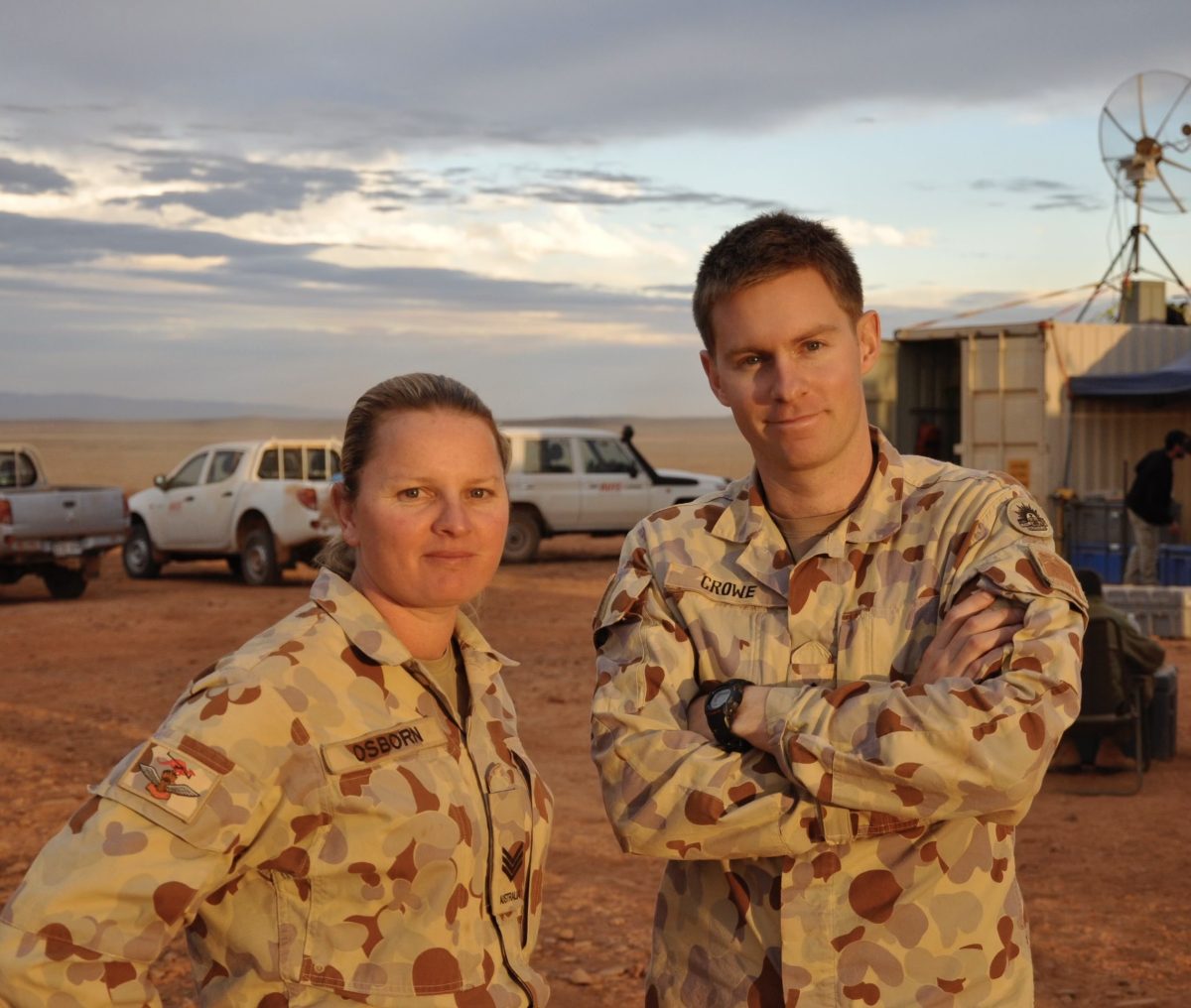 man and woman in Army uniforms