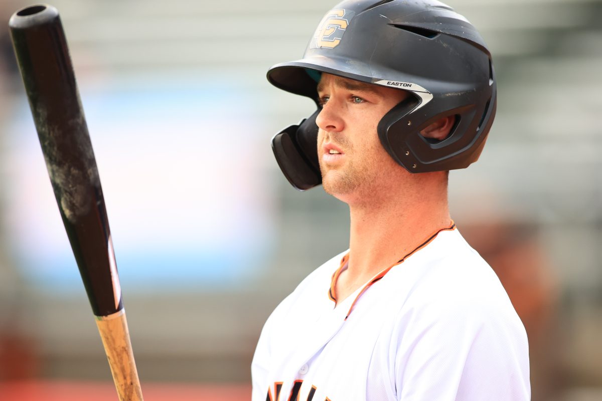 Canberra Cavalry's Cory Acton holding a baseball bat