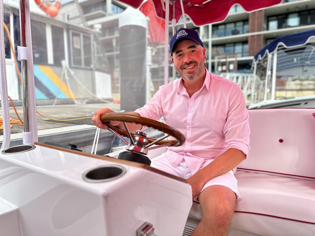 Charles Chatain sitting in a boat