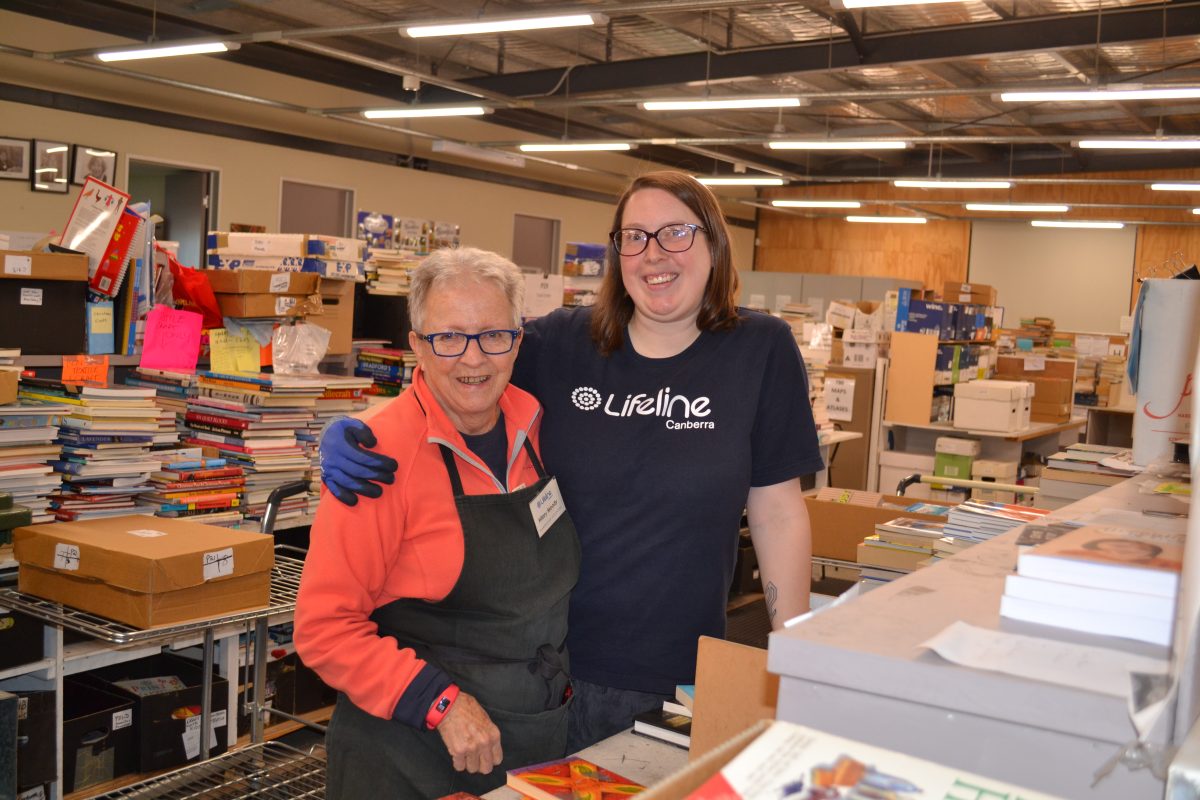 Two volunteers at the Lifeline wearhouse