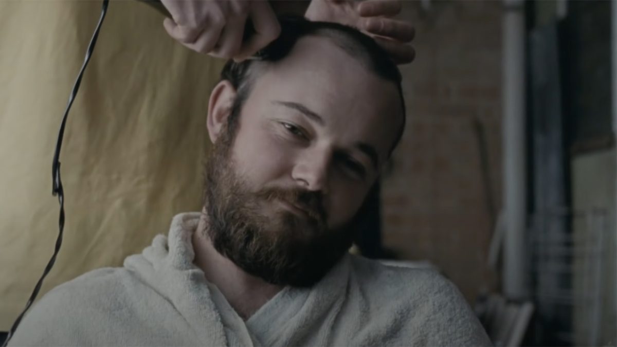 Still from Snowtown showing a man having his head shaved