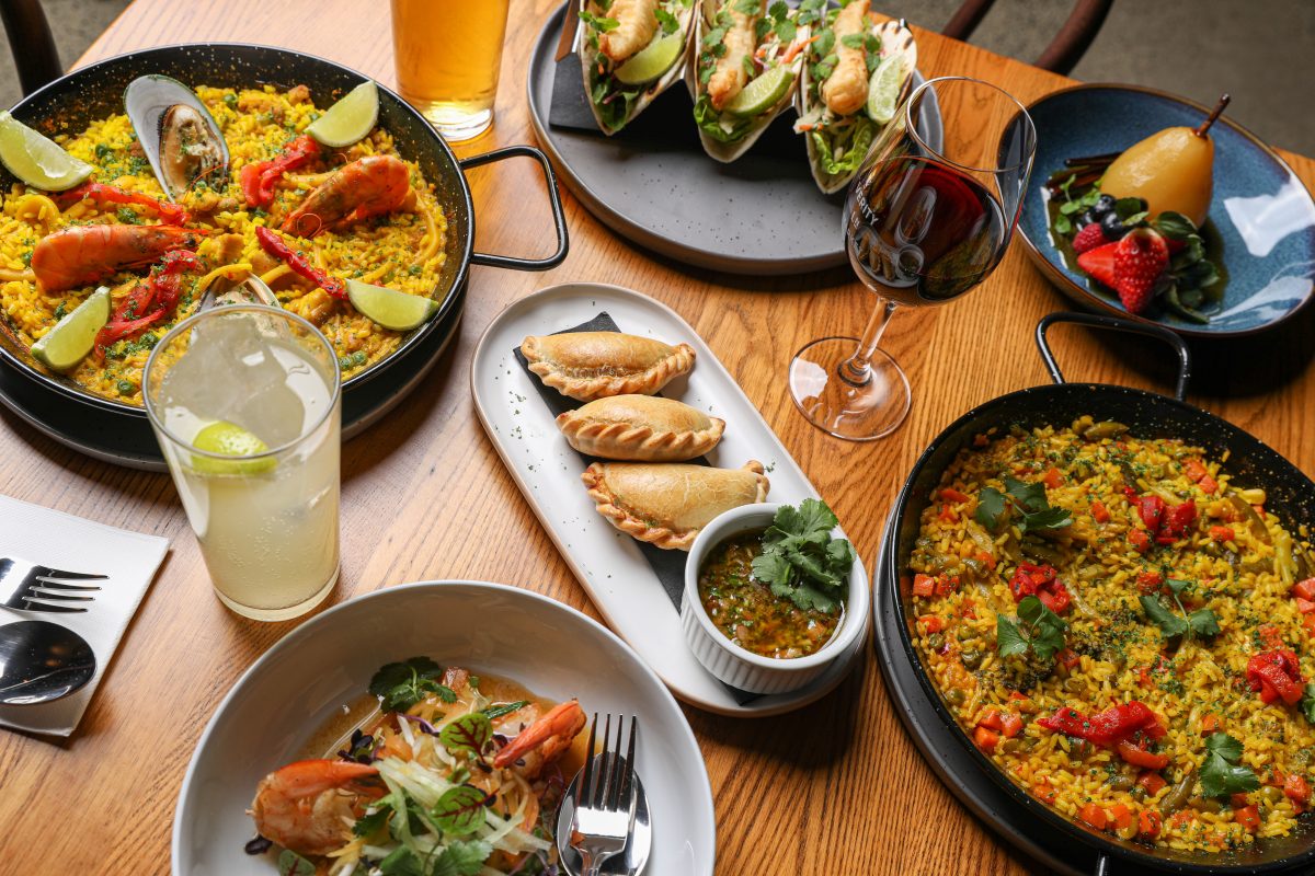 A spread of La Cocina Pura dishes on a table.