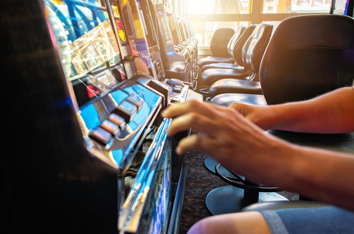 person playing poker machine