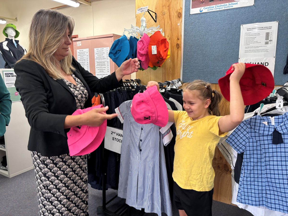 Yvette Berry in school uniform shop with child