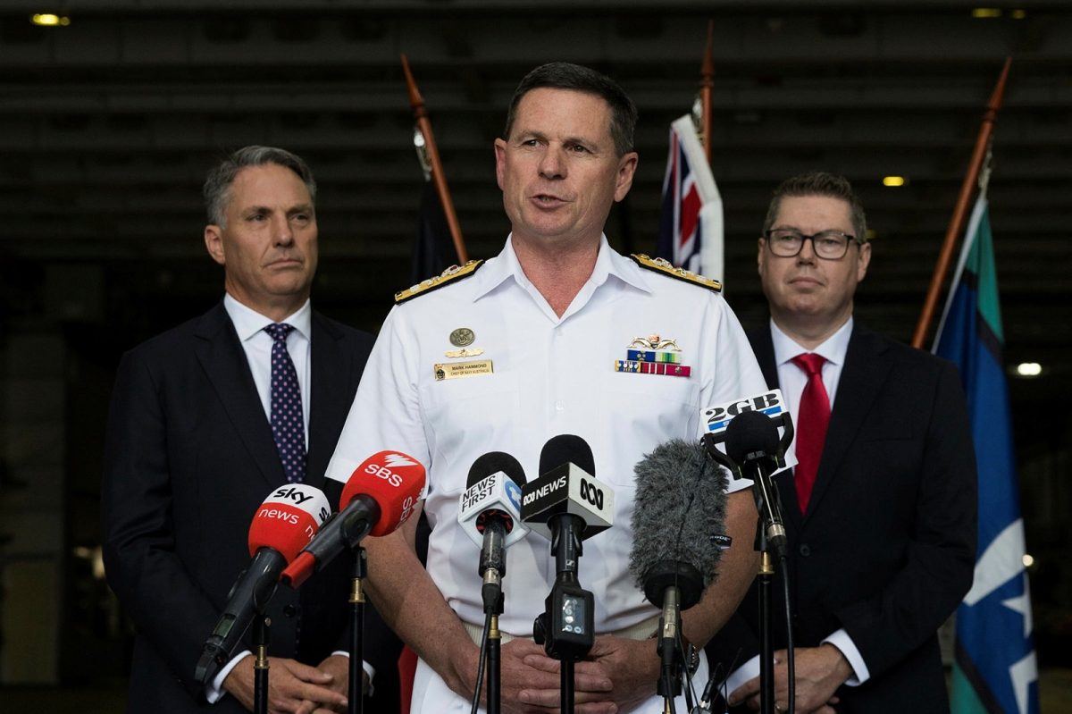 navy chief and two politicians at press conference