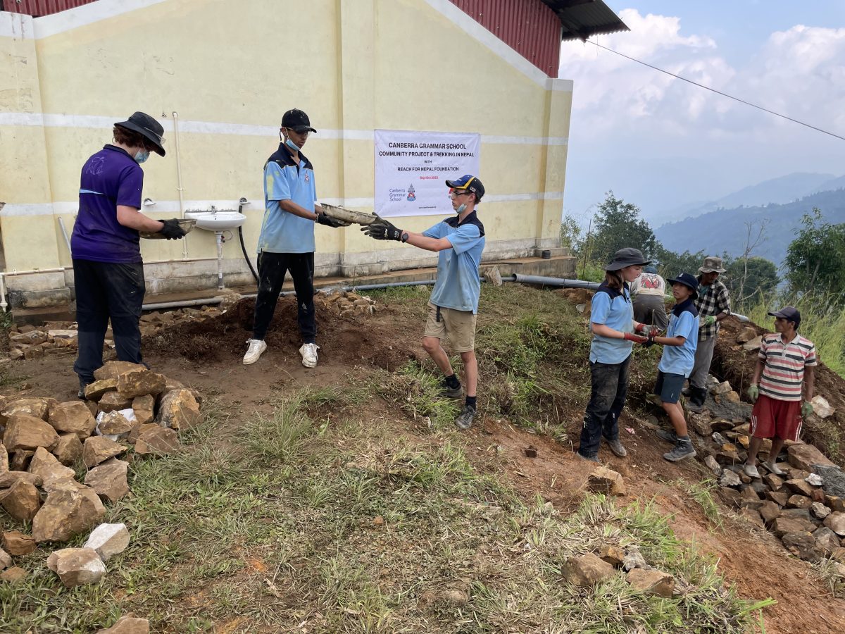 students building a water tank in Nepal