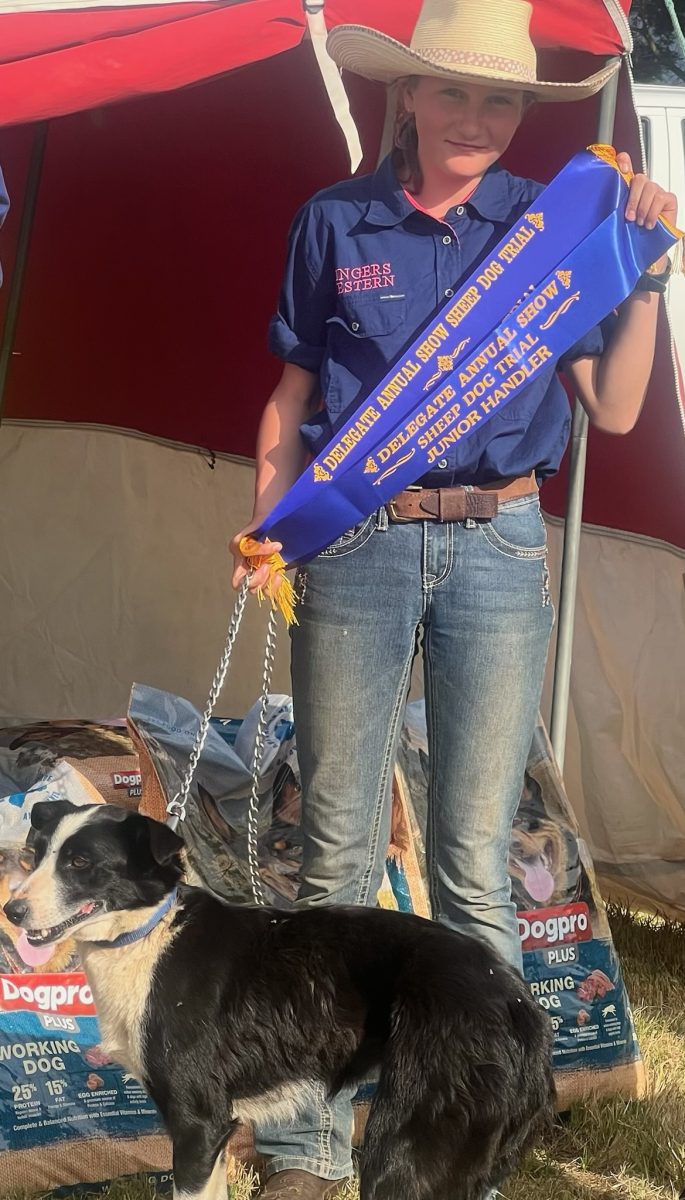 Young woman with ribbons and dog