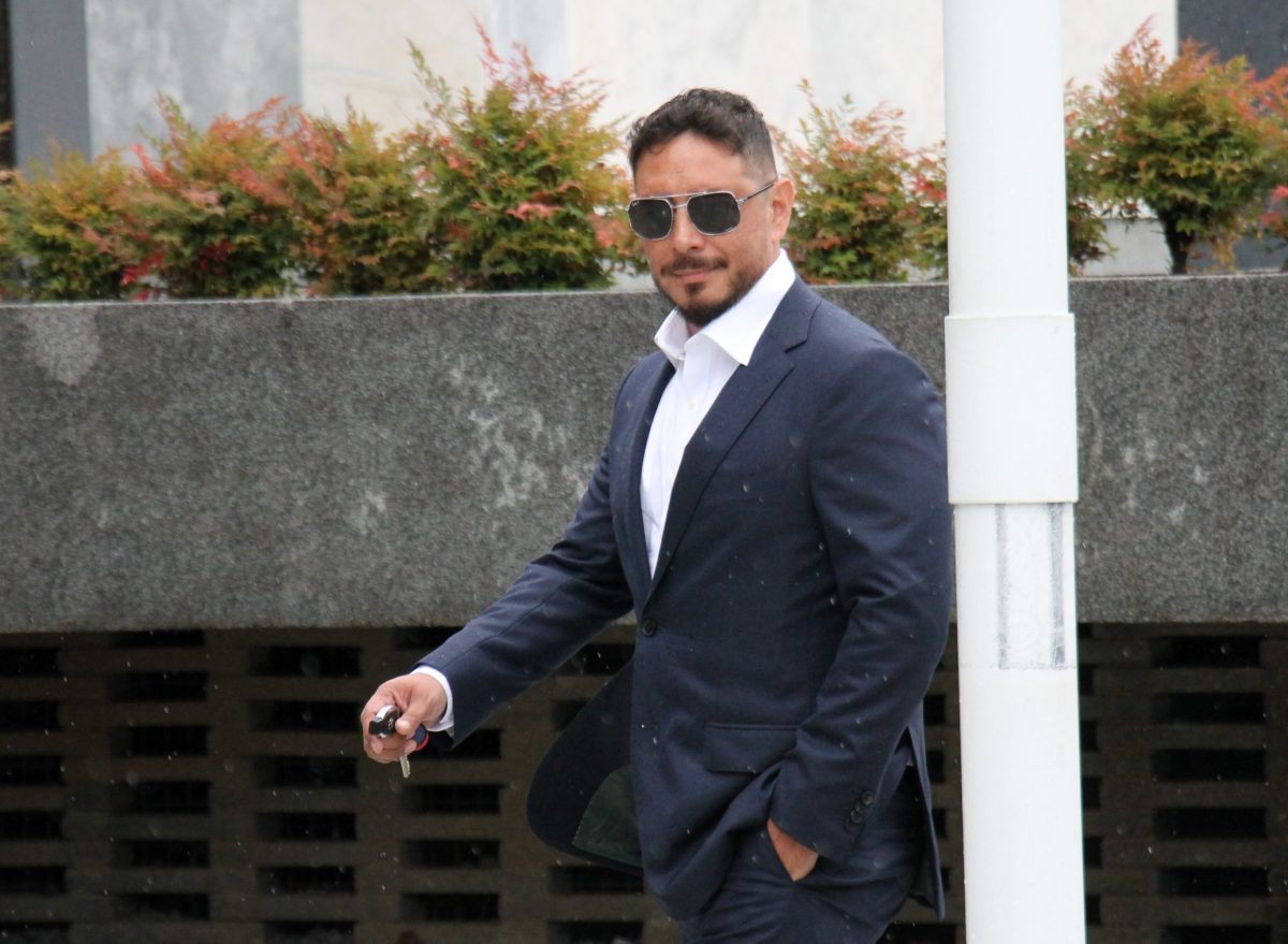 man in suit walking to court