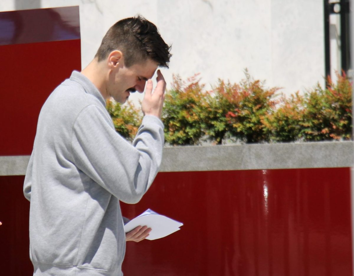 man walking outside court