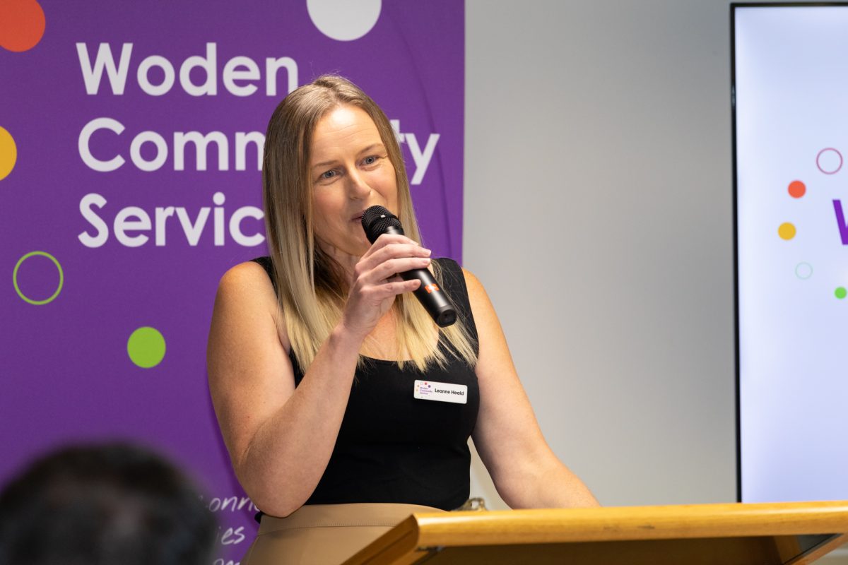 woman speaking at lectern