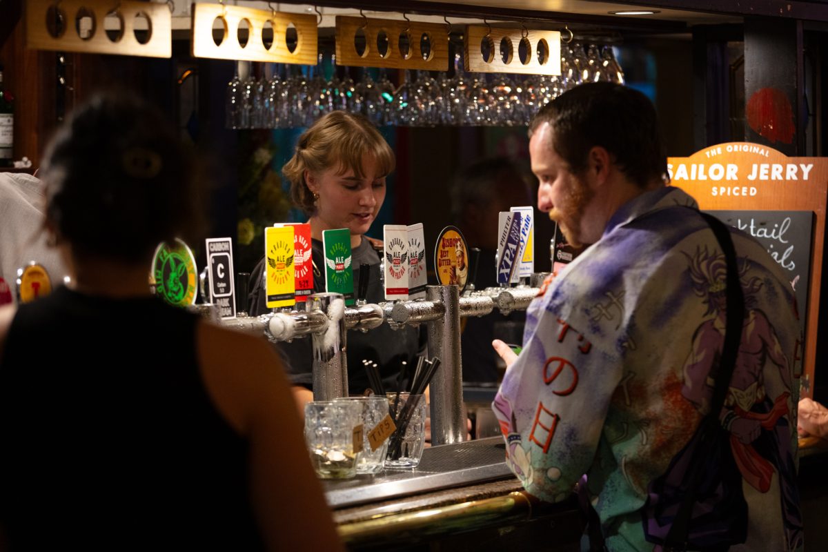 People waiting at a bar