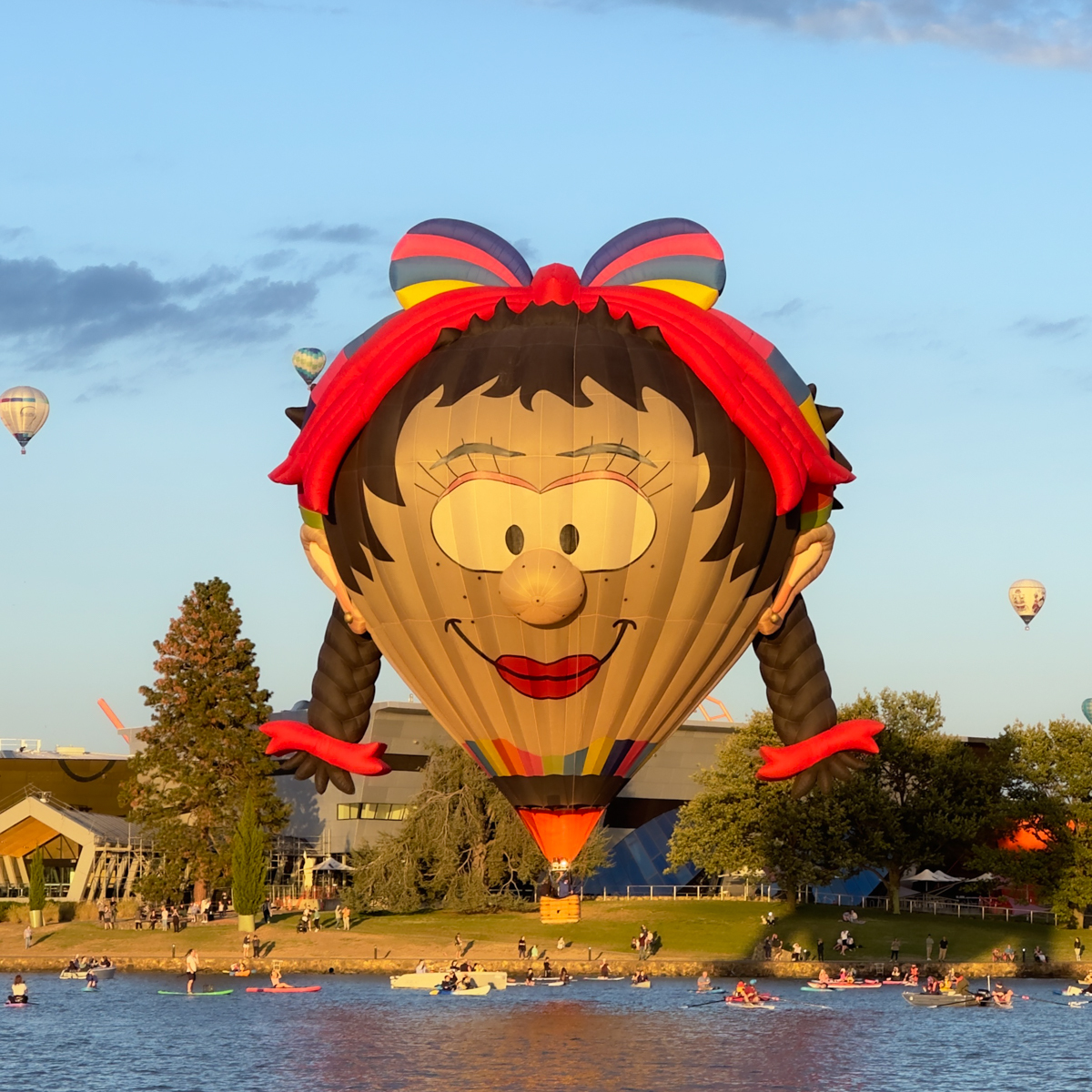 Hot-air balloon over lake