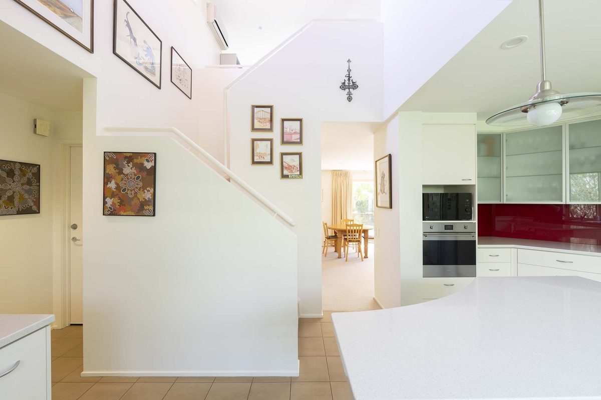 Stairwell with high ceilings at 2/72 Novar Street in Yarralumla