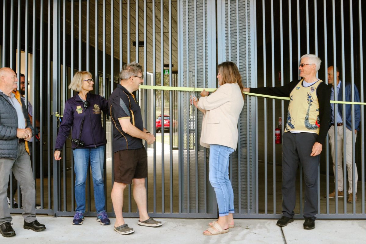 Yvette Berry cuts a ribbon