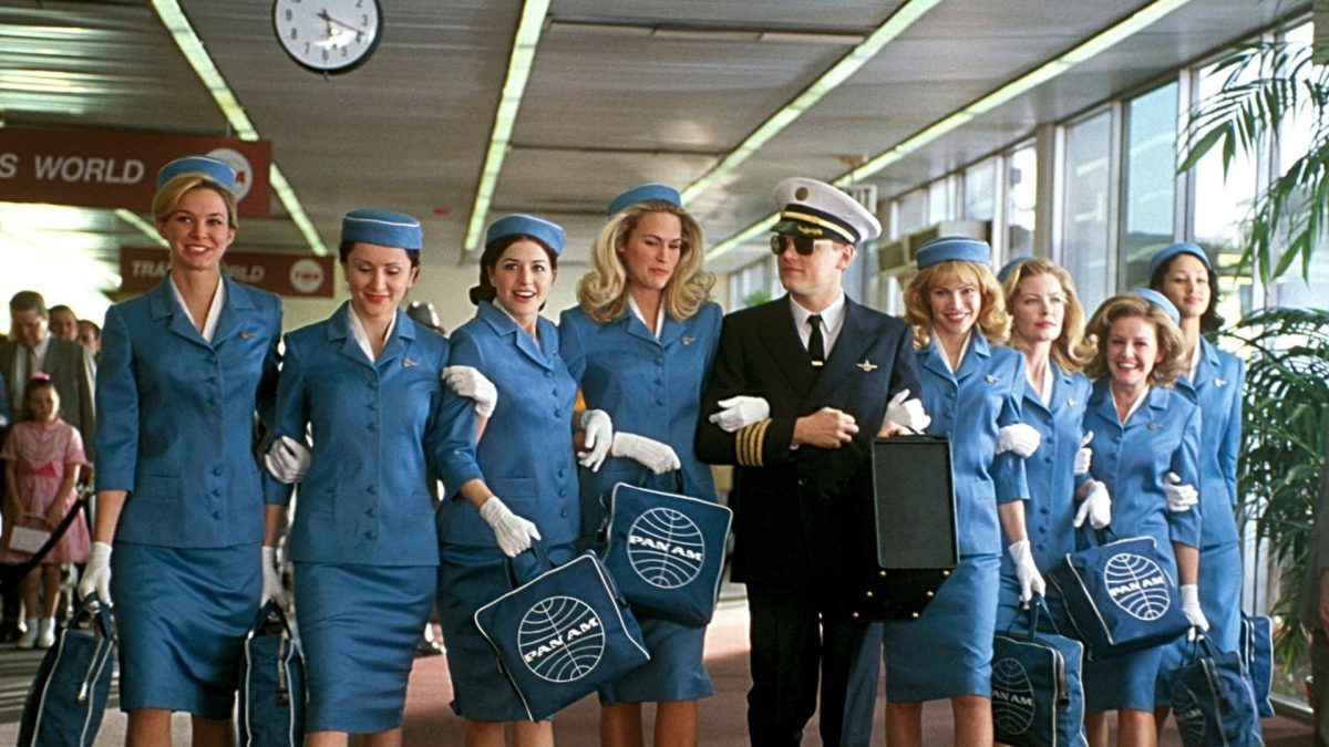 Still from Catch Me If You Can showing a pilot with a group of air hostesses