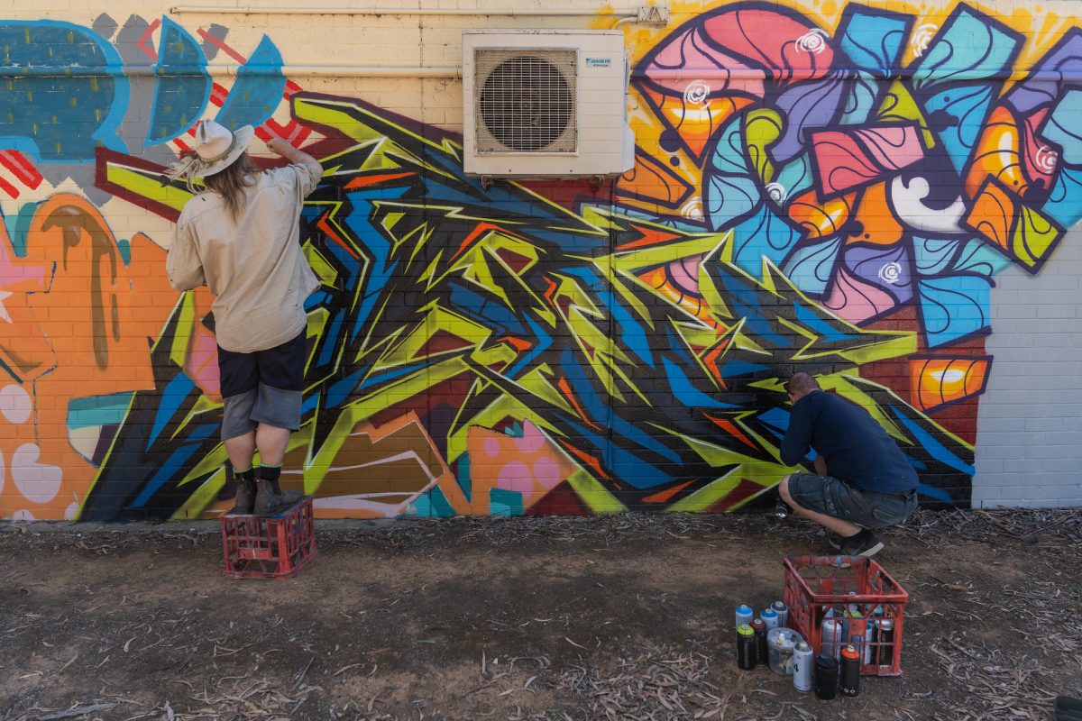 man painting a mural 