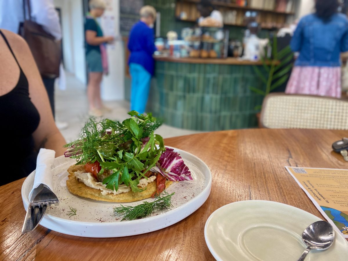 Tasty looking toast dish garnished with leafy greens.